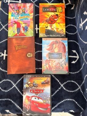 4 Vintage Disney movies and 1 Warner Brothers movie